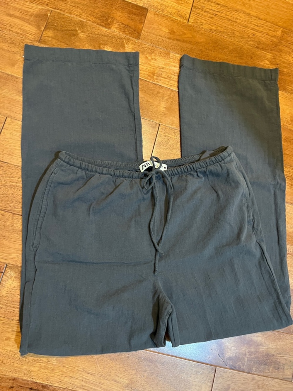 Zara wide-leg pants featuring a dark gray color with elastic and drawstring clos
